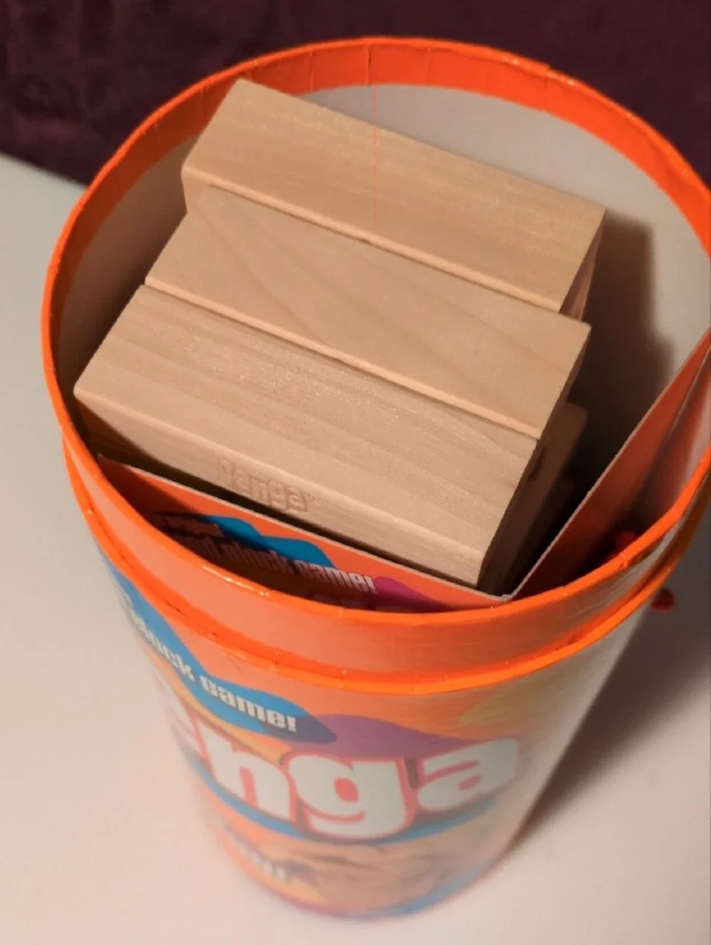 Hasbro Jenga Wooden Block Game - Orange Multicolor Tube- Tan Wooden Blocks